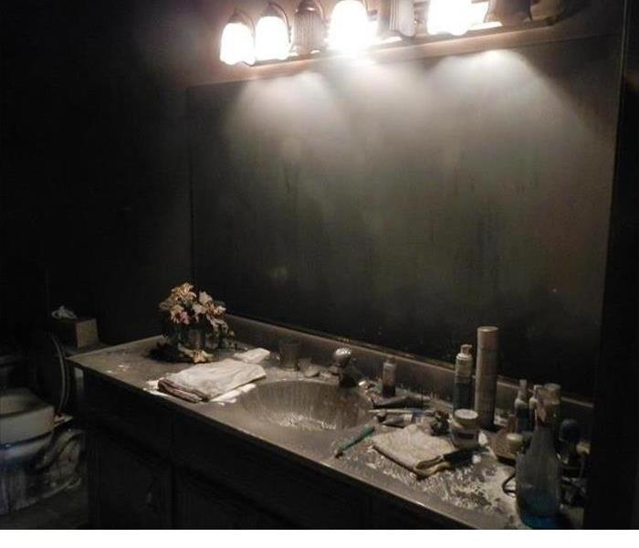 blackened walls in a bathroom after a fire 